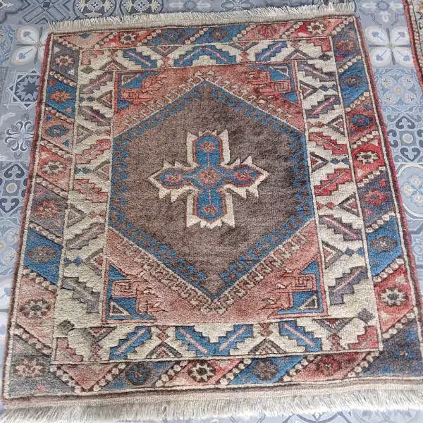 Rug before cleaning Auckland – stained and dirty rug prior to professional cleaning