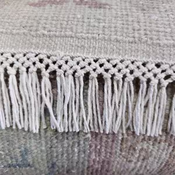 Professional Chinese rug fringe repair and replacement in Auckland with decorated tassels, restoring damaged fringe and improving the finish through expert hand-crafted restoration by The Rug Guru