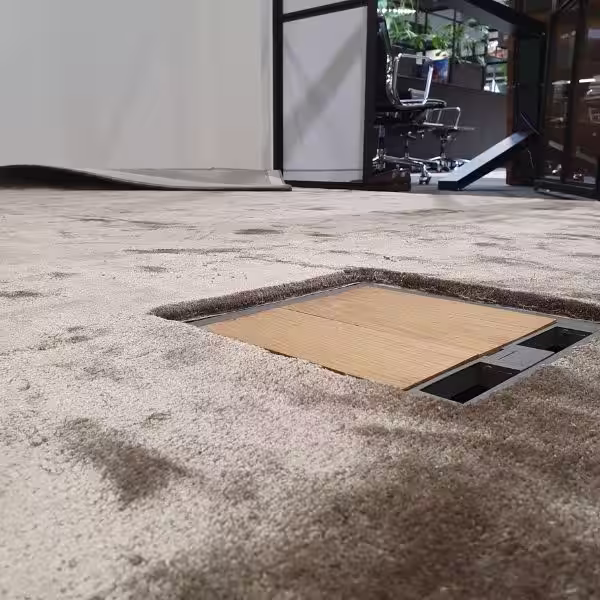 Custom rug cutting in Auckland for precise floor socket and outlet fitting in modern interiors using large rugs with accurate structural trimming and installation by The Rug Guru and St Lukes rug specialist