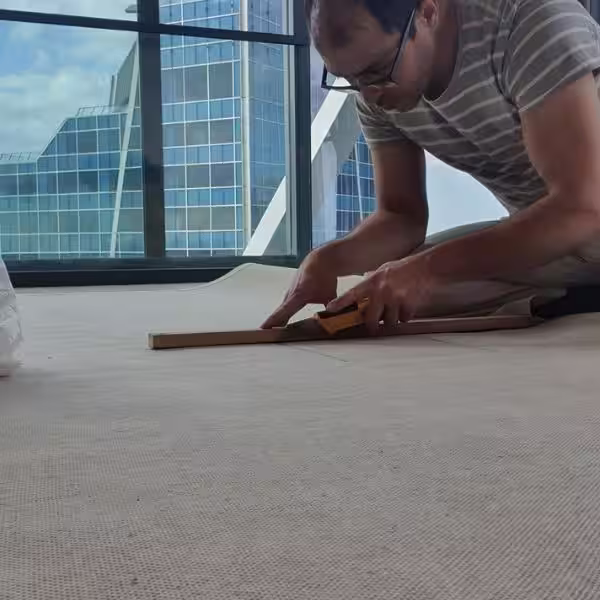 Custom rug fitting in Auckland with precise floor socket and interior cut-out integration for large handmade and designer rugs by The Rug Guru