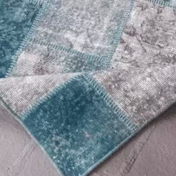 Structural rug backing support for handmade wool rug in Auckland restoration workshop
