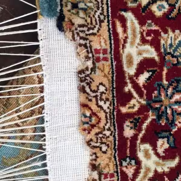 Oriental rug restoration showing detailed colour correction, pattern repair and structural stabilisation by The Rug Guru in Auckland