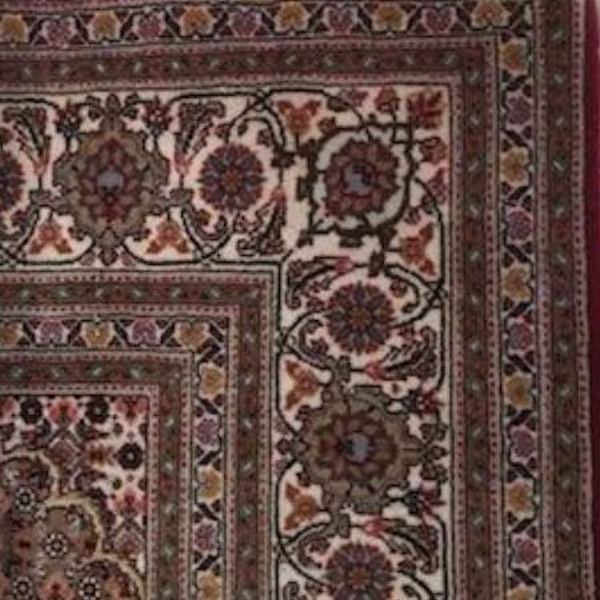 Persian rug after colour restoration with improved colour depth, tonal balance, and restored pattern visibility