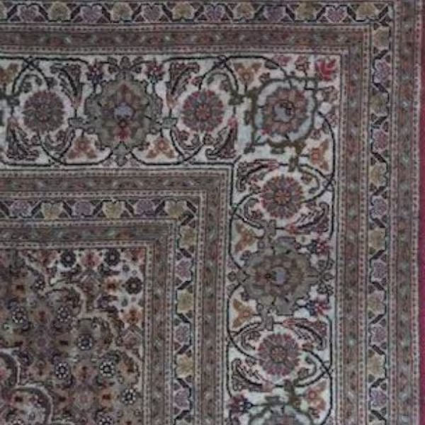 Faded Persian rug before colour restoration showing UV fading, colour loss, and reduced pattern clarity