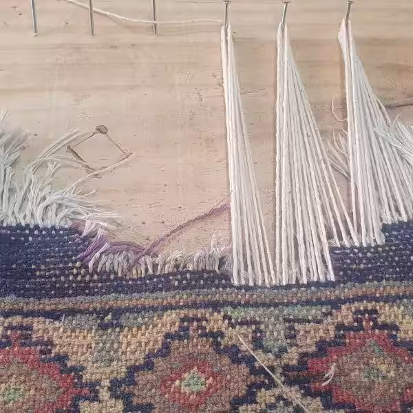Professional rug fringe and tassel replacement in Auckland restoring missing sections with precise hand-crafted restoration techniques by The Rug Guru