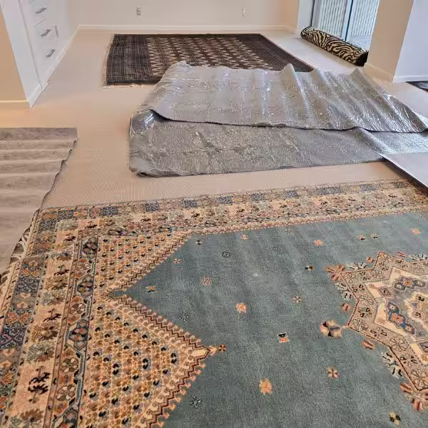 Non-slip rug underlay installed beneath a handmade rug to improve floor stability, reduce movement, and prevent friction damage