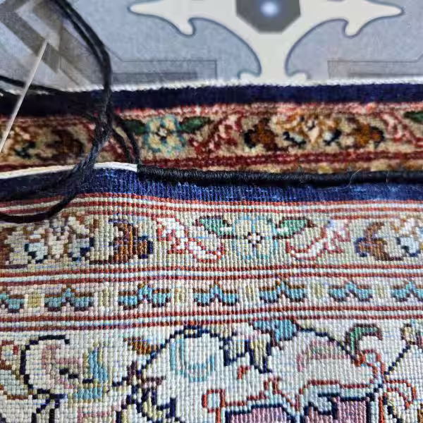 Silk rug edge conversion with reinforced structural binding in Auckland