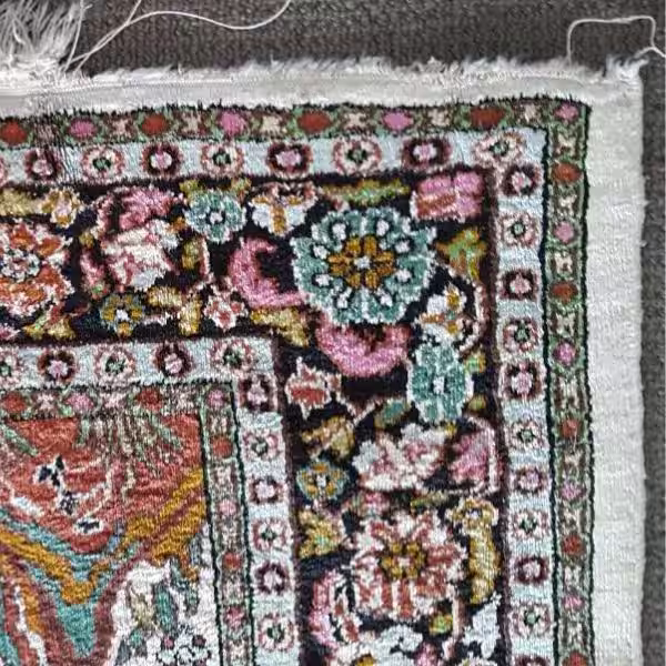 Professional silk rug fringe repair in Auckland restoring delicate fringe and damaged edges with precise hand knotting and specialist restoration techniques by the rug guru