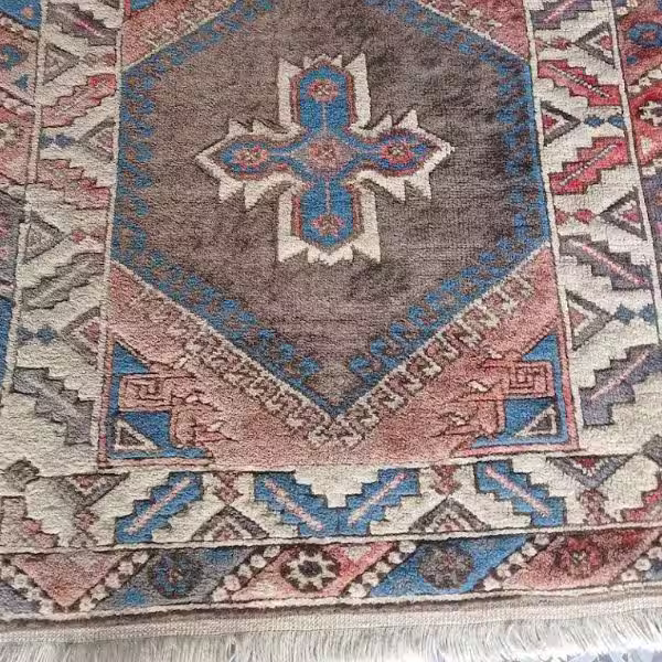 Sun faded Persian rug before restoration Auckland
