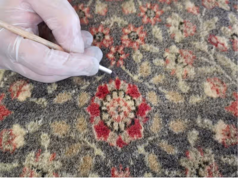 Surface refinement process during antique rug restoration in Auckland improving fibre texture and restoring visual clarity at The Rug Guru