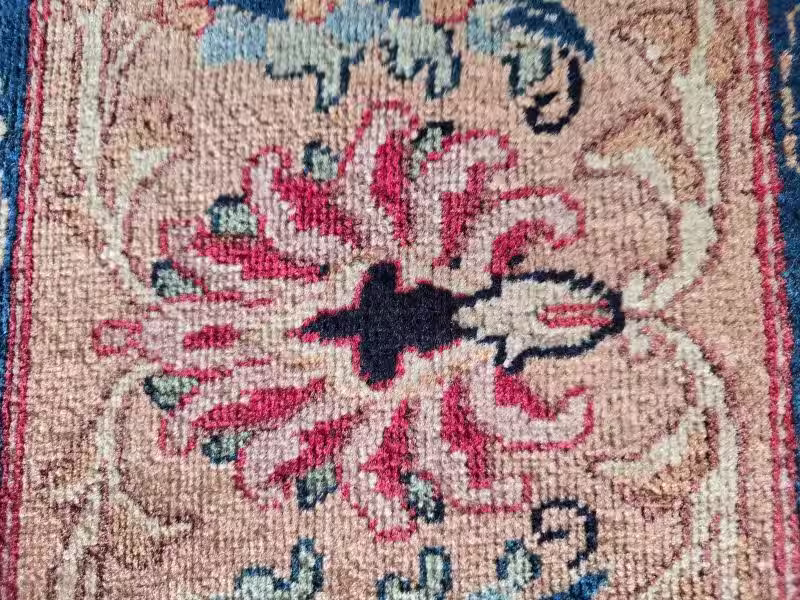 Oriental rug conservation focused on motif preservation and tonal restoration work