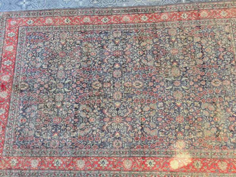 Oriental rug visual restoration focusing on tonal rebalance and design preservation