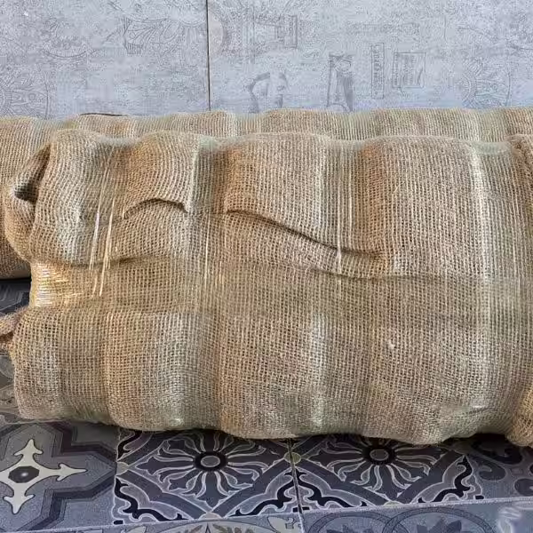 Rug wrapped with protective layers designed to reduce pest and moth damage in storage conditions