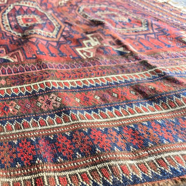 Rug bubbles and raised sections causing uneven surface before stretching treatment