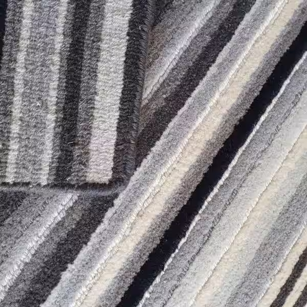 This rug fringe blocked and converted to bind, modern edging