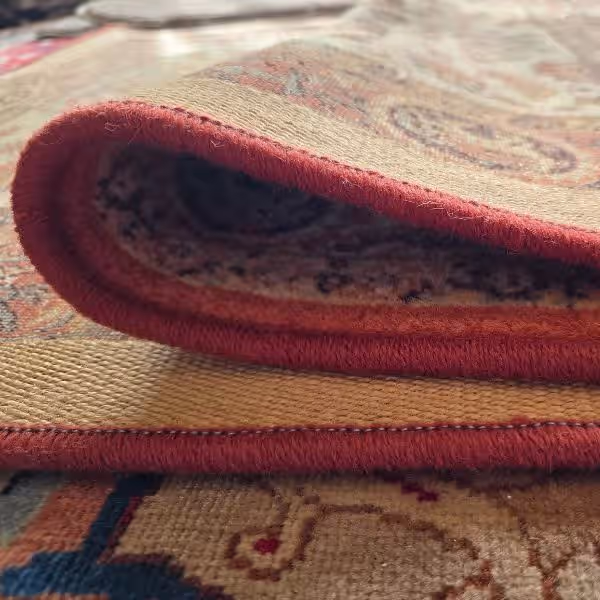 Professional workshop in Auckland performing carpet overlocking and edge finishing on custom carpets