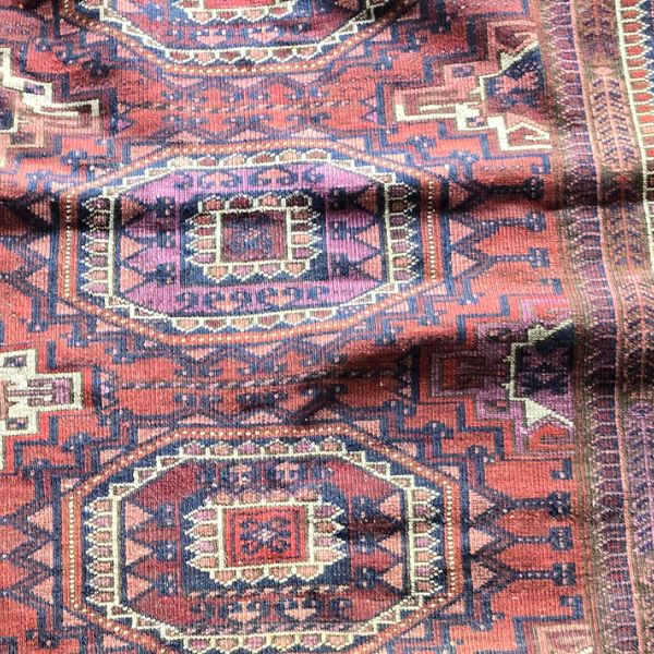 Wrinkled area across a rug before professional rug stretching service in Auckland