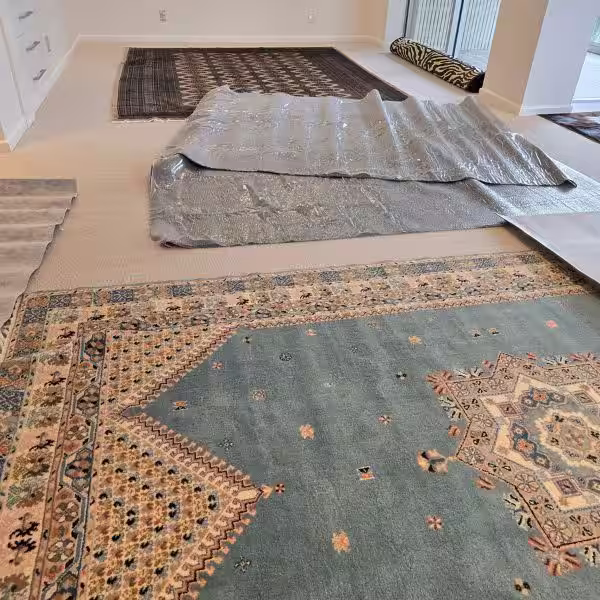Underlay fitted under a rug to improve floor stability and reduce slipping on hard surfaces