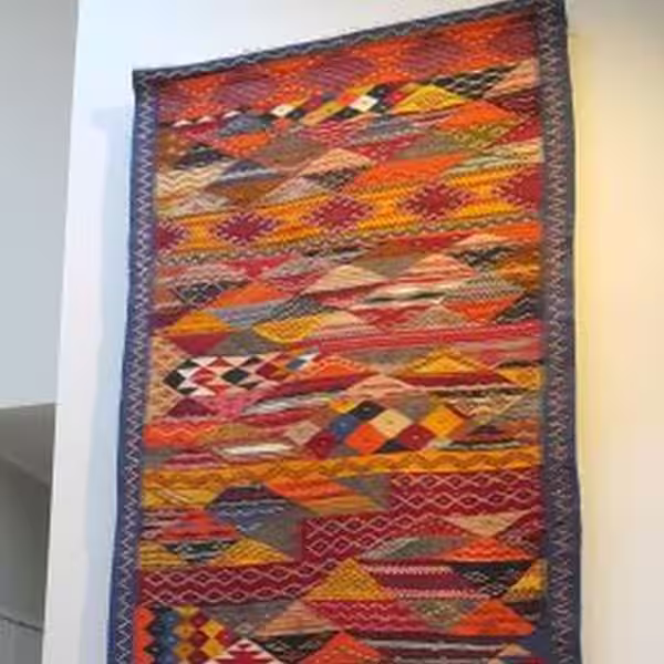 Final rug wall hanging installation in Auckland showing tension alignment and load balance verification